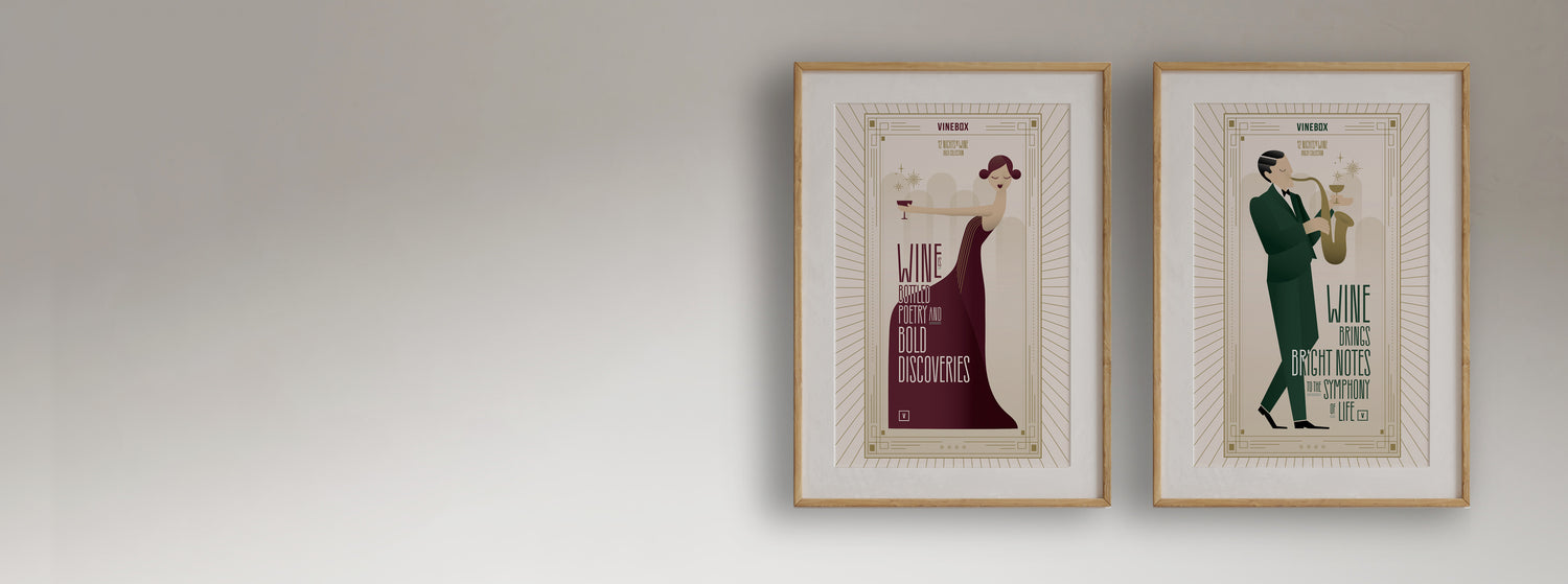Two framed posters of a woman and a man on a plain wall.