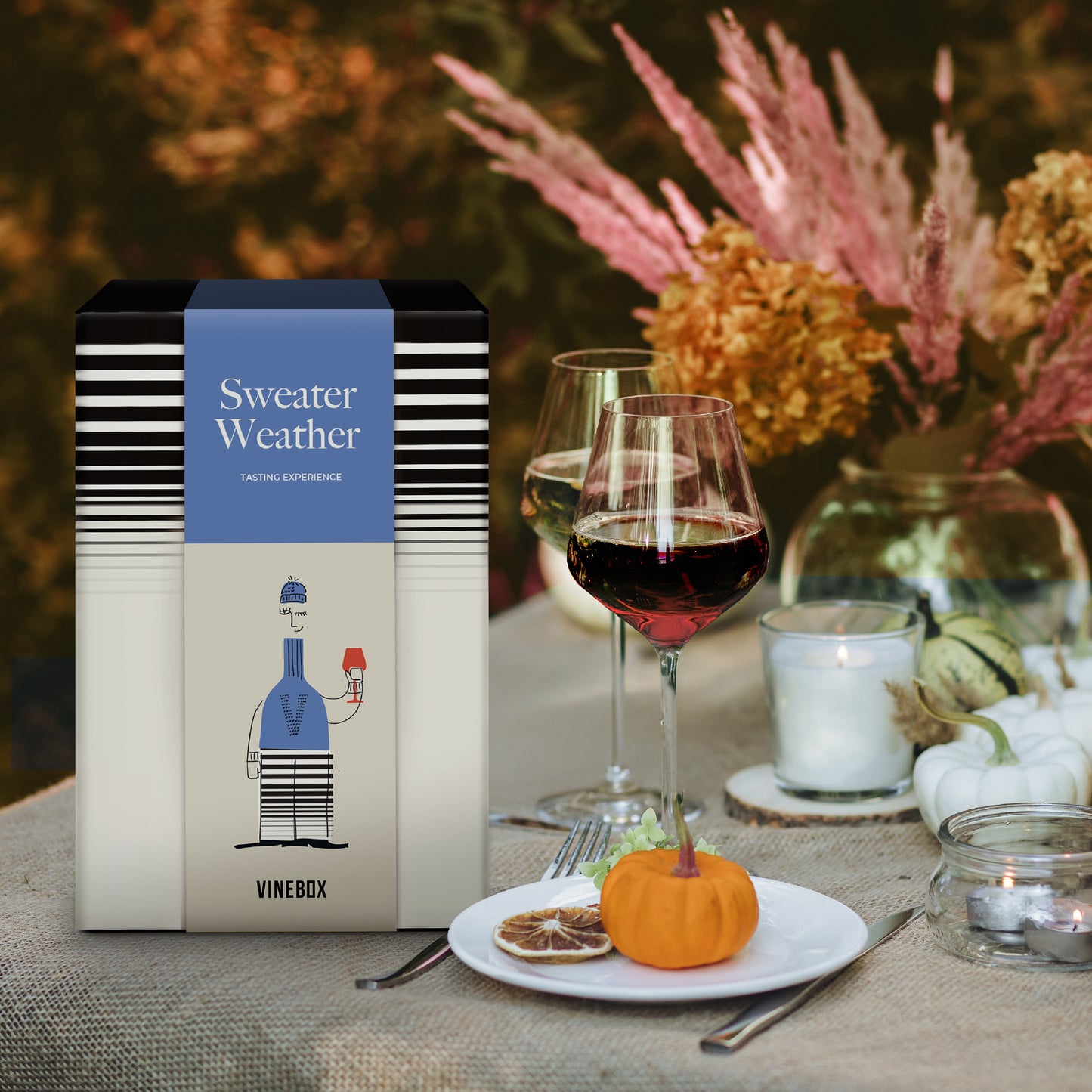 Vinebox sweater weather wine box on a table with wine glasses