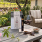 Vinebox Gratitude 9-wine tasting wine gift  box, bottle, glass of red wine, sunglasses, and bowl on a table with a vineyard background