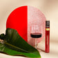 100ml tube of Vinebox wine and glass of wine with artistic background