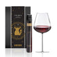 Vinebox Taurus zodiac wine bottle with packaging and a glass of red wine on a white background