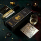 Vinebox Wine box with Taurus zodiac design, wine bottle, glass, and card on a dark surface with star and moon decorations.